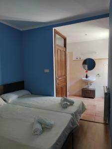 Katil atau katil-katil dalam bilik di Albergue rural l'Almada de Yebra