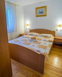 A bed or beds in a room at Knežević Apartment