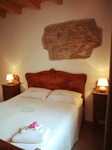 Postel nebo postele na pokoji v ubytování B&B La Corte del Segrino