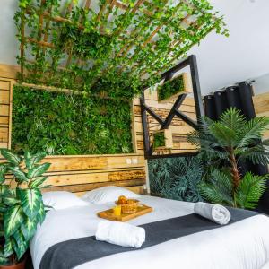 Katil atau katil-katil dalam bilik di Kawaii - Domaine Tropical