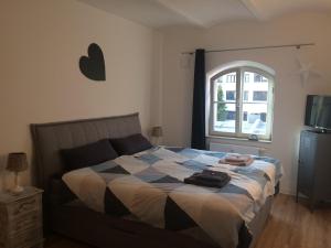 Posteľ alebo postele v izbe v ubytovaní Stadt-Apartment