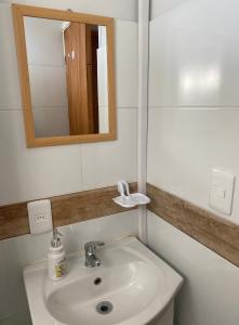 a bathroom with a sink and a mirror at Casita de Piedra 2 in Trinidad