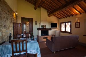 a living room with a couch and a fireplace at Agriturismo Podere Fornacino in Castelnuovo Berardenga