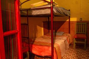 Postel nebo postele na pokoji v ubytování Hostalito Casa Alebrije