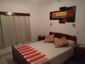 En eller flere senger på et rom på Casa El Descanso