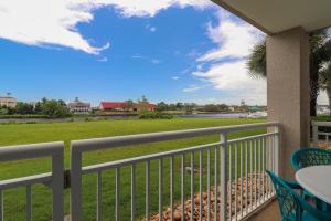 a balcony with a view of a park at Yacht Club Villas #3-103 condo in Myrtle Beach