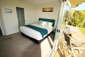 Katil atau katil-katil dalam bilik di Awatuna Sunset Lodge