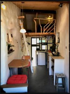 a small kitchen with a table and a desk at Le Triplex in Vernet-les-Bains