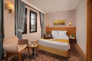 Postel nebo postele na pokoji v ubytování Almina Hotel - Special Class