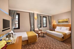 Postel nebo postele na pokoji v ubytování Almina Hotel - Special Class