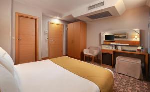 Postel nebo postele na pokoji v ubytování Almina Hotel - Special Class