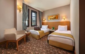 Postel nebo postele na pokoji v ubytování Almina Hotel - Special Class