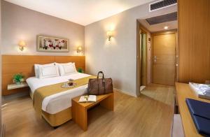 Postel nebo postele na pokoji v ubytování Almina Hotel - Special Class