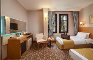 Postel nebo postele na pokoji v ubytování Almina Hotel - Special Class