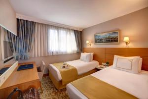 Postel nebo postele na pokoji v ubytování Almina Hotel - Special Class