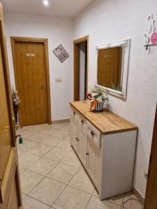 a kitchen with a counter and a mirror on the wall at Apartment Markus in Makarska