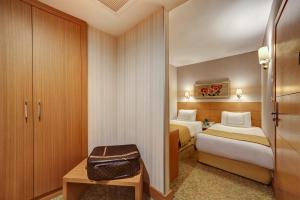 Postel nebo postele na pokoji v ubytování Almina Hotel - Special Class