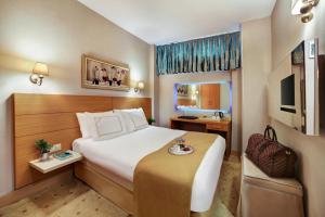 Postel nebo postele na pokoji v ubytování Almina Hotel - Special Class