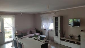 a living room with a couch and a table at Smestaj Djordjevic in Pirot