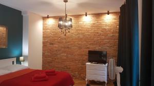 Posteľ alebo postele v izbe v ubytovaní H&T Old Town Szeroka 36