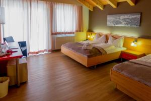 Postel nebo postele na pokoji v ubytování Hotel Auwirt Zentrum