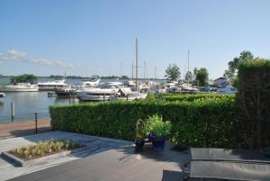 a view of a marina with boats in the water at Chalet Veluwemeerzicht Elburg in Biddinghuizen