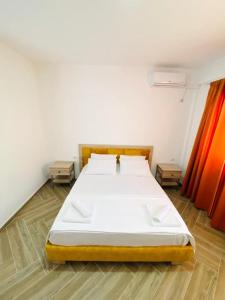 Säng eller sängar i ett rum på SeaScape Vila