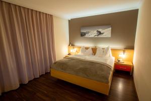 Postel nebo postele na pokoji v ubytování Hotel Auwirt Zentrum