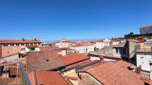an aerial view of a city with roofs at Tartini Square House FERGO in Piran