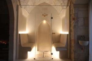 a glass shower stall in a bathroom with lights at Lanime - Bed in Spa in Sogliano Cavour +7 photos