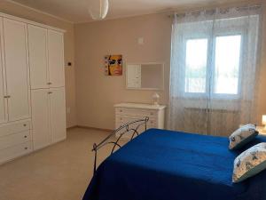 Rúm í herbergi á Villa Baccile