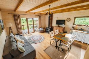 a living room with a couch and a table at Shanti House in Migovo