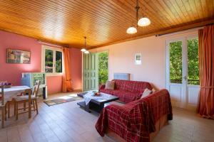 a living room with a couch and a table at Konstantino's House in Áyios Ilías