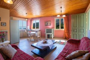 a living room with a couch and a table at Konstantino's House in Áyios Ilías +12 photos