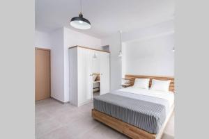 Postel nebo postele na pokoji v ubytování Maisonnette Giannis