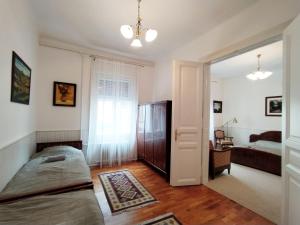 Postel nebo postele na pokoji v ubytování Atelier Keszthely