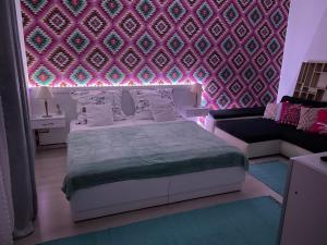 Postel nebo postele na pokoji v ubytování Joy Apartman