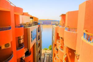 a view of a street between some orange buildings at Aswan Plaza Hotel in Aswan