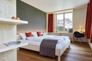 Krevet ili kreveti u jedinici u okviru objekta Hotel Klausenpass
