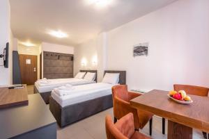 Letto o letti in una camera di Tino Hotel & SPA