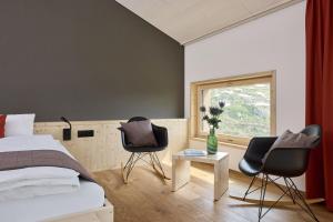 Krevet ili kreveti u jedinici u okviru objekta Hotel Klausenpass