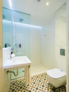 a bathroom with a sink and a toilet at ibis Styles Golden Sands Roomer Hotel in Golden Sands