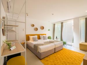 a bedroom with a bed and a ladder in it at ibis Styles Golden Sands Roomer Hotel in Golden Sands