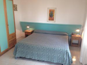 Postel nebo postele na pokoji v ubytování Hotel Gemma