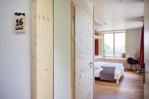 Krevet ili kreveti u jedinici u okviru objekta Hotel Klausenpass