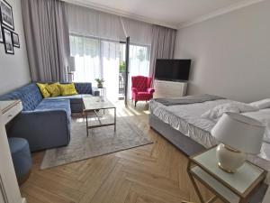 Televízia a/alebo spoločenská miestnosť v ubytovaní Apartament Międzyzdroje 006 w Maritime Residence