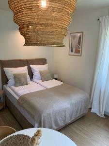 Łóżko lub łóżka w pokoju w obiekcie Na Wczasowej - Apartamenty