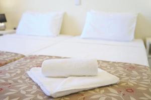 A bed or beds in a room at The Sunset Villa Kefalonia
