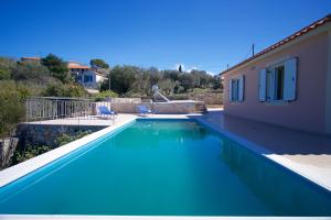 The swimming pool at or close to The Sunset Villa Kefalonia