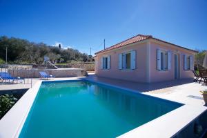 The swimming pool at or close to The Sunset Villa Kefalonia